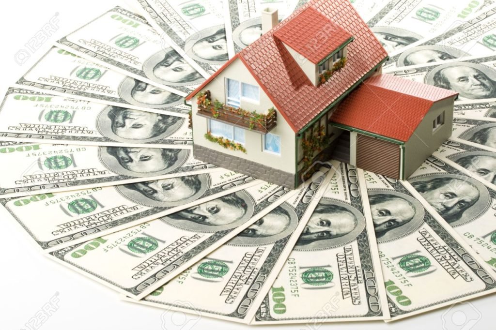 3360761 Miniature House and Money Buying house concept Stock Photo