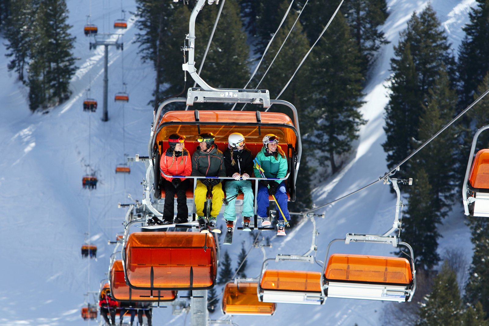 Skiers Riding Orange Bubble